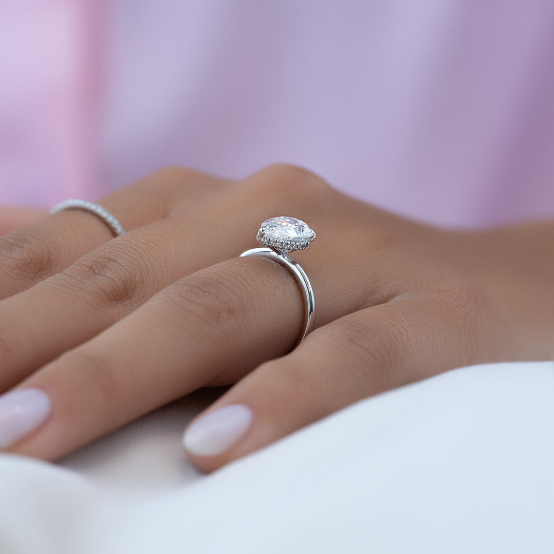 Shop the pear cut hidden halo engagement ring collection online