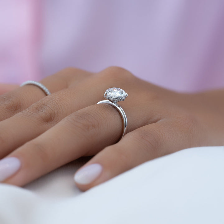 Shop the pear cut hidden halo engagement ring collection online