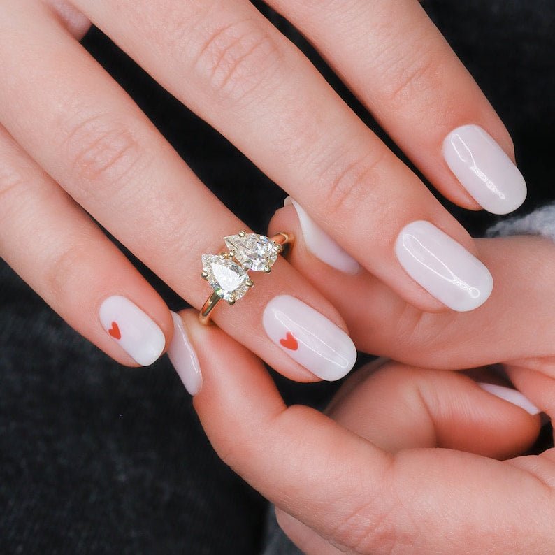 Pear solitaire lab grown diamond ring fitted on finger
