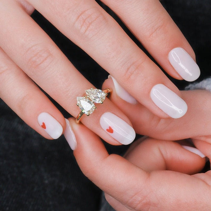 Pear solitaire lab grown diamond ring fitted on finger