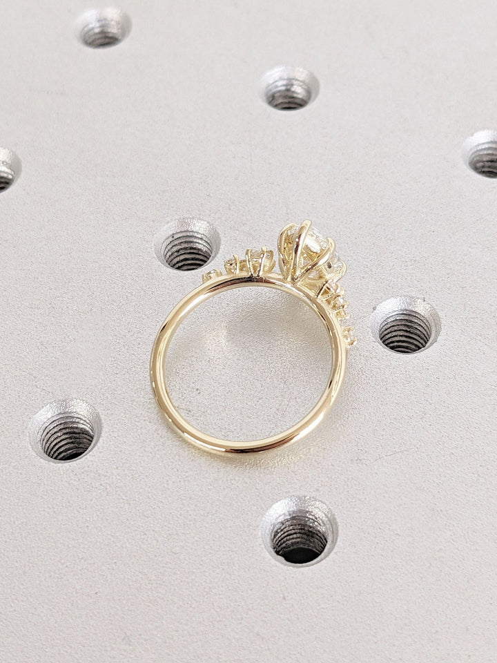 Fine craftsmanship detail on pear cluster engagement ring