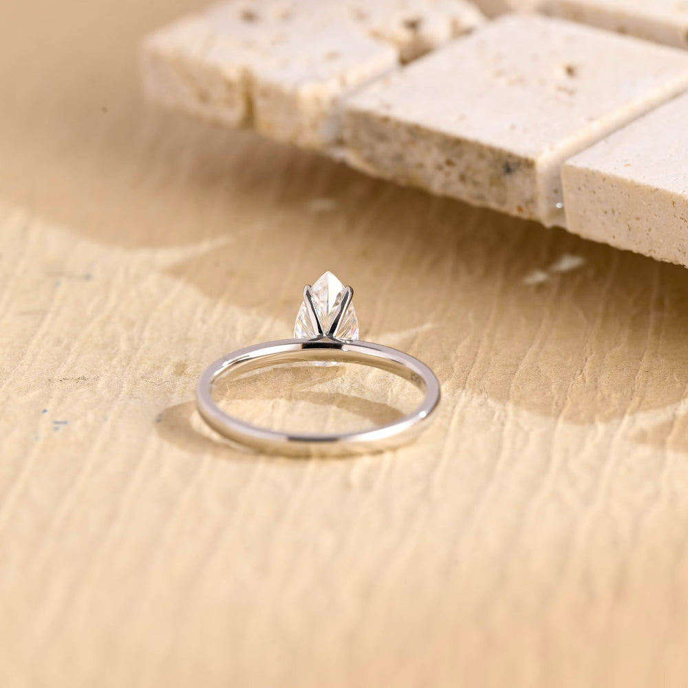Unboxing view of pear cut solitaire diamond engagement ring