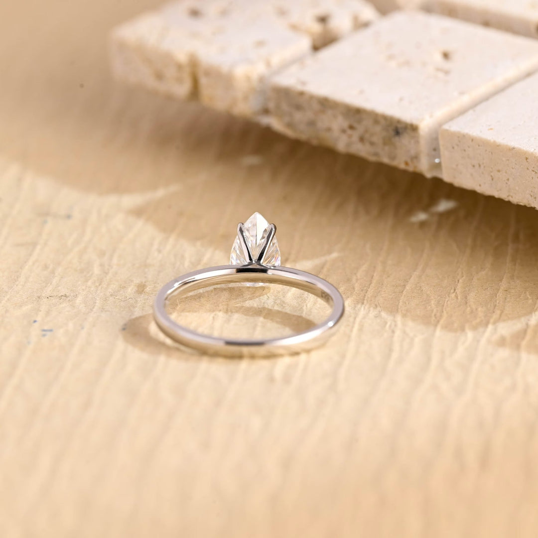 Unboxing view of pear cut solitaire diamond engagement ring