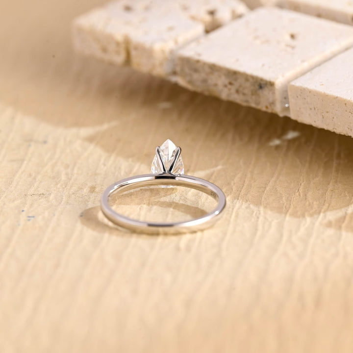 Unboxing view of pear cut solitaire diamond engagement ring