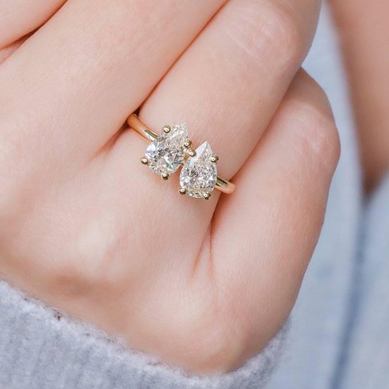 Pear solitaire engagement ring viewed from the side