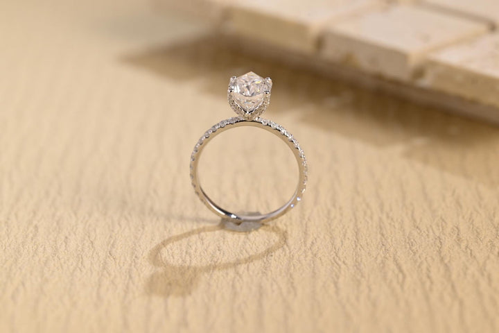 Pear hidden halo engagement ring close-up showing high clarity diamond clarity