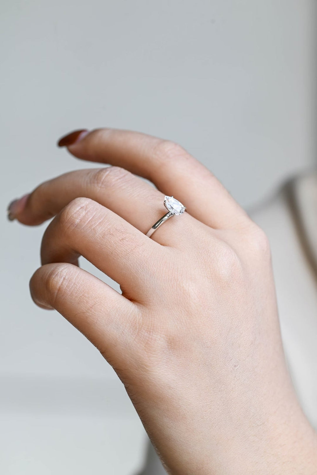 Pear solitaire engagement ring finished in polished solid gold