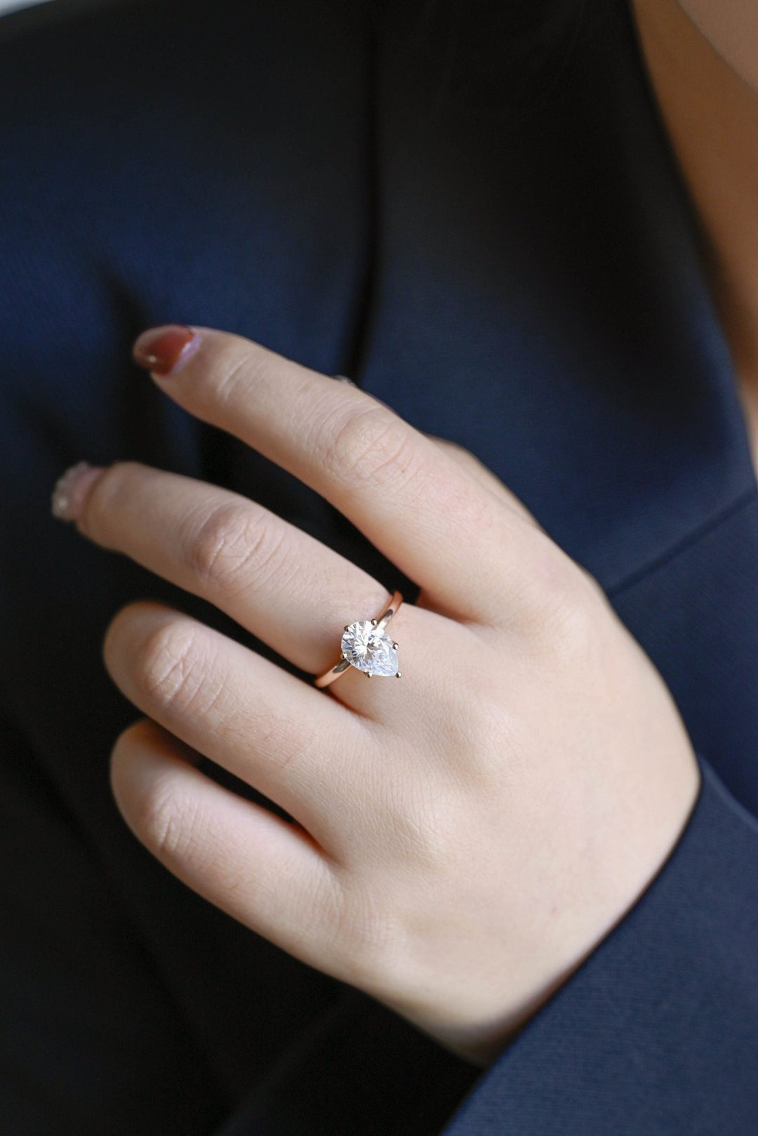 Fine craftsmanship detail on pear hidden halo engagement ring