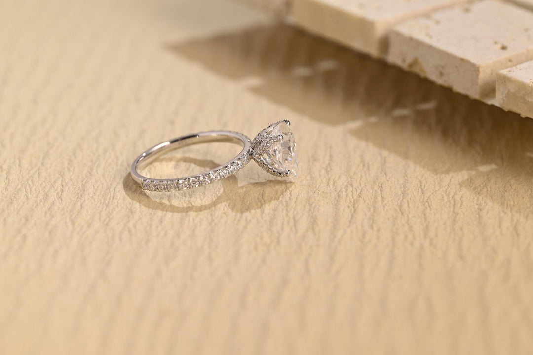 Pear hidden halo engagement ring with brilliant diamond sparkle