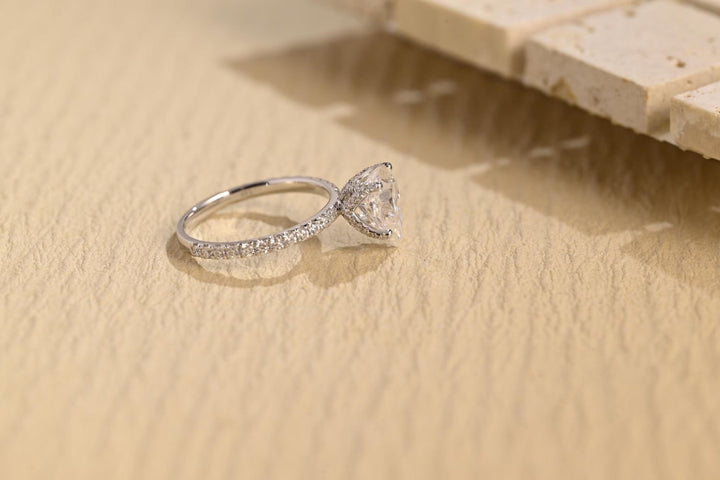 Pear hidden halo engagement ring with brilliant diamond sparkle