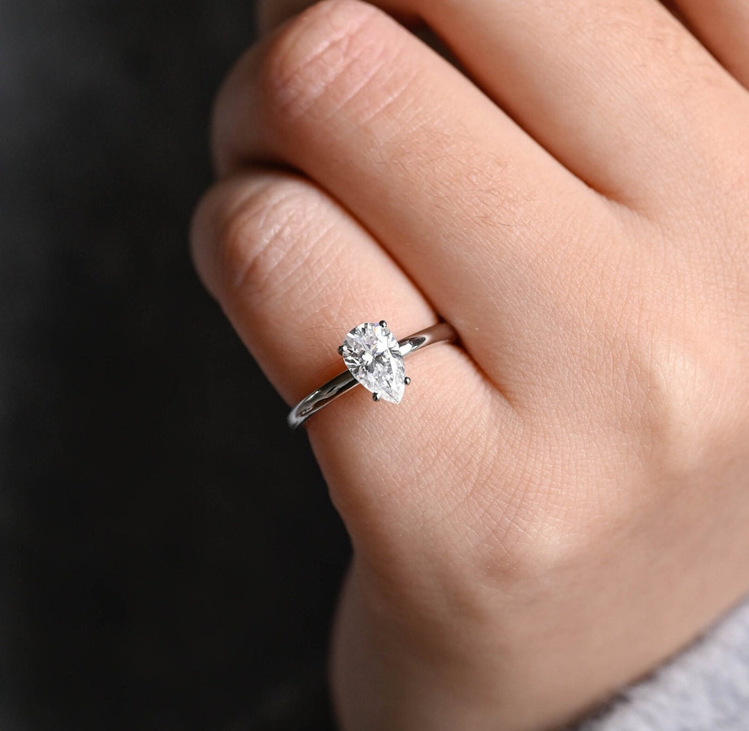 Pear solitaire engagement ring with brilliant diamond sparkle