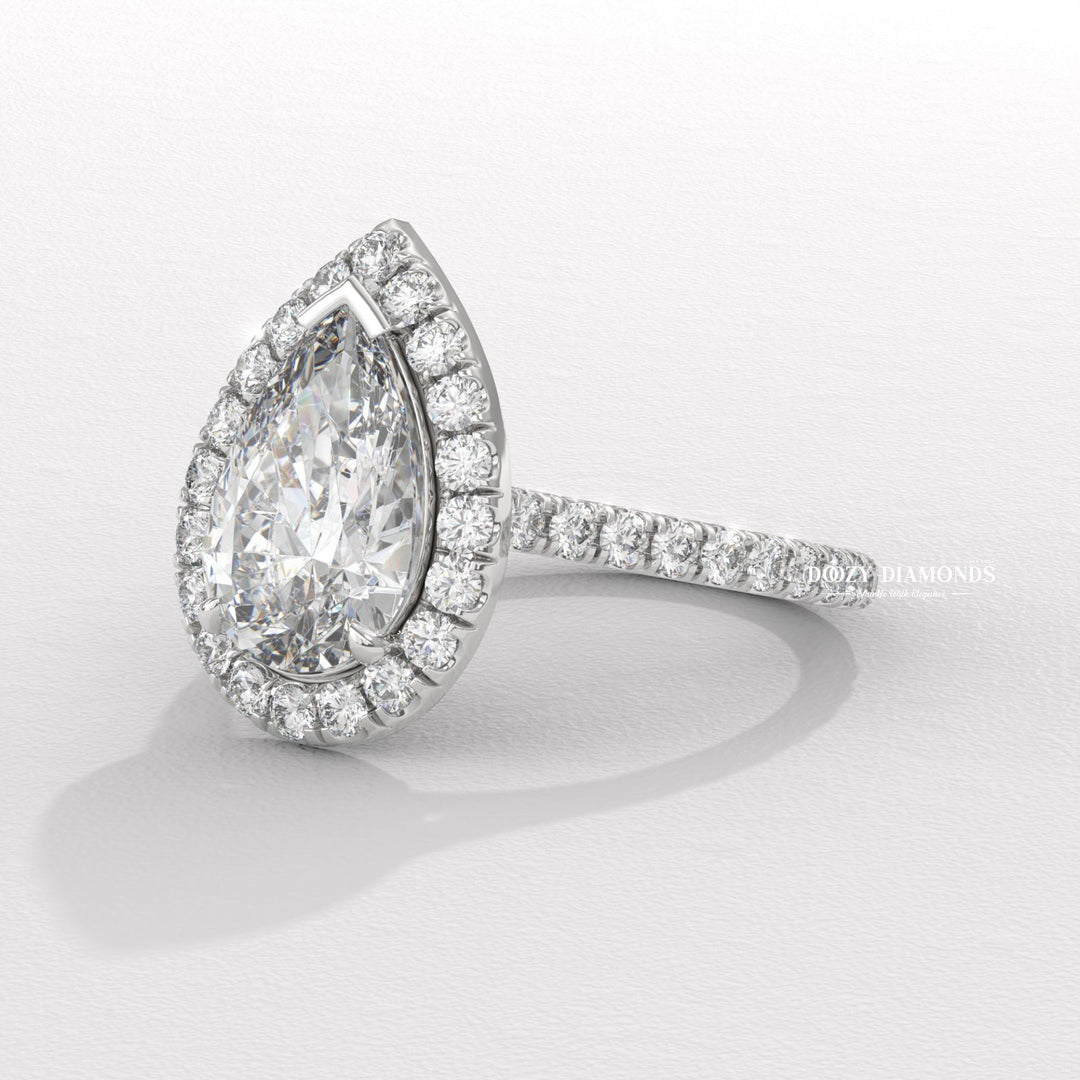 Pear halo engagement ring viewed from the side