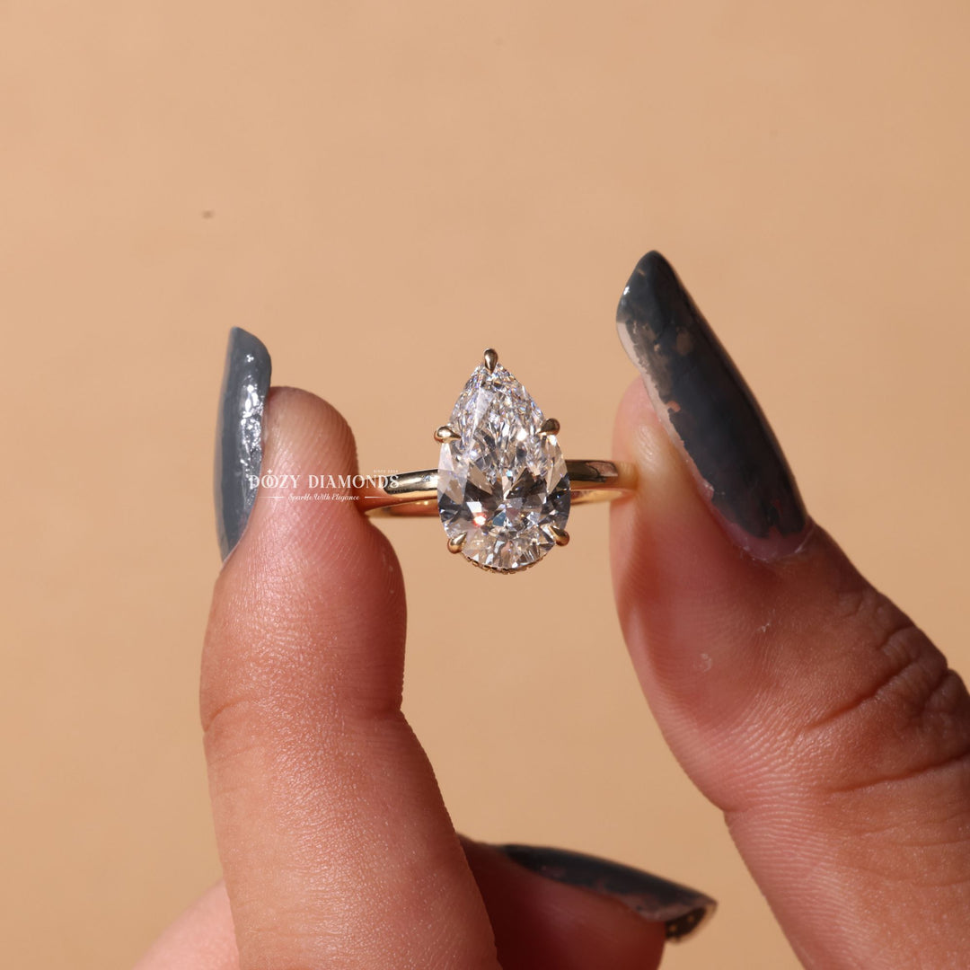 Pear hidden halo engagement ring with brilliant diamond sparkle
