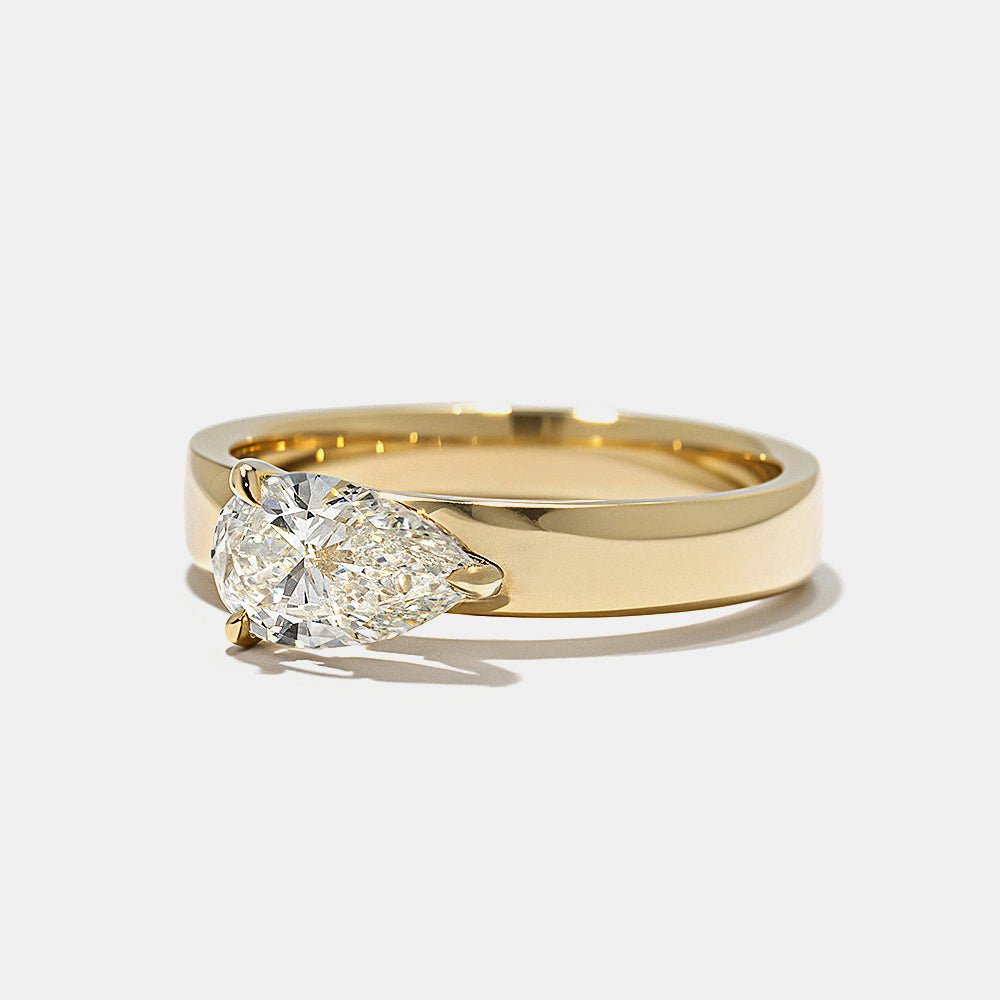 Pear east west lab grown diamond ring side profile in gold setting