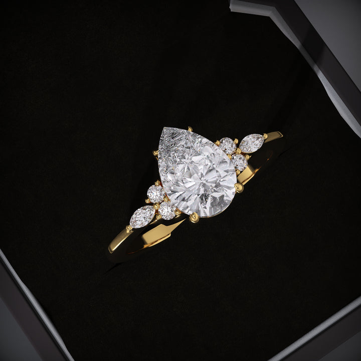 Pear cut cluster engagement ring available to buy now