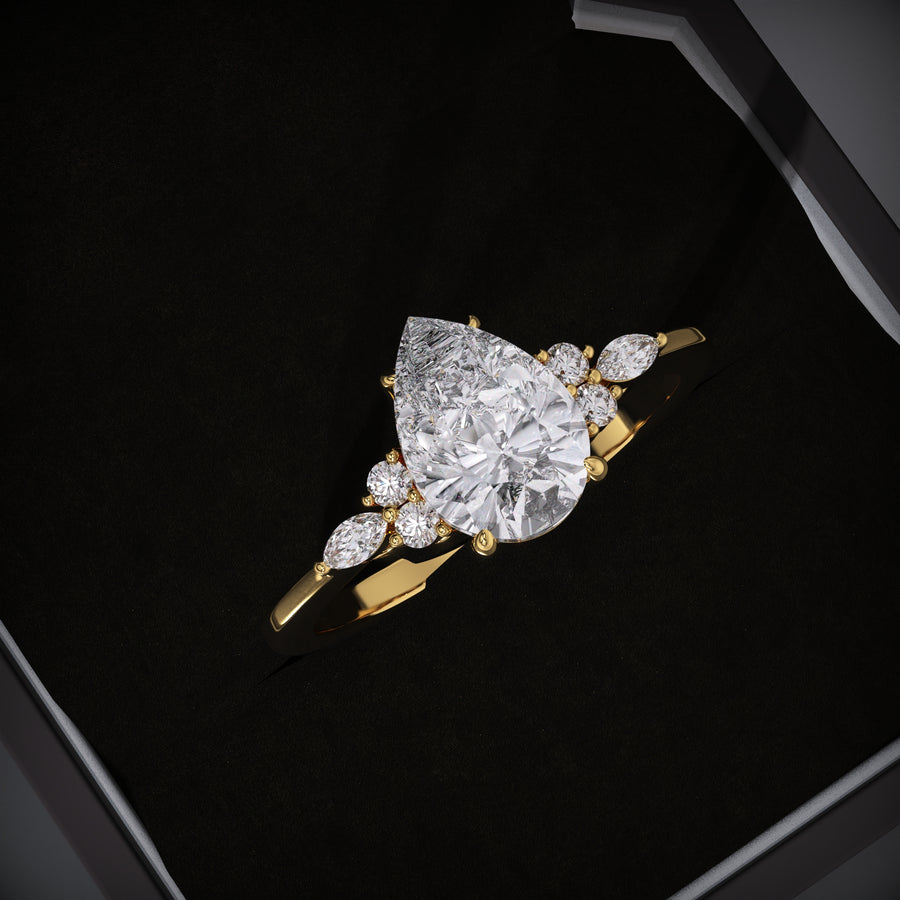 Pear cut cluster engagement ring available to buy now