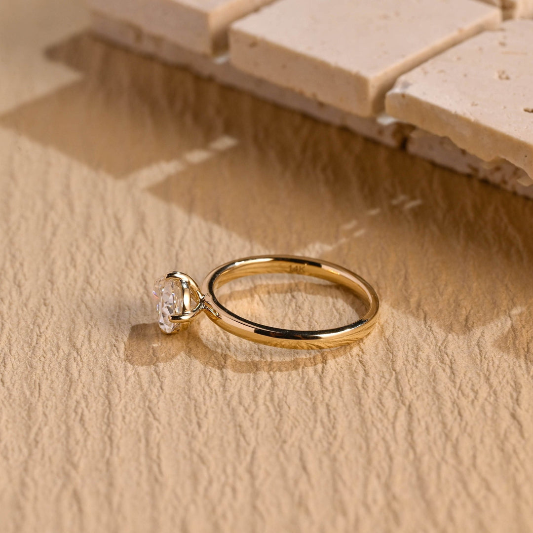 Top-down view of pear cut east west engagement ring