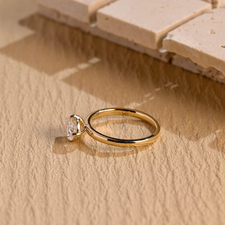 Top-down view of pear cut east west engagement ring