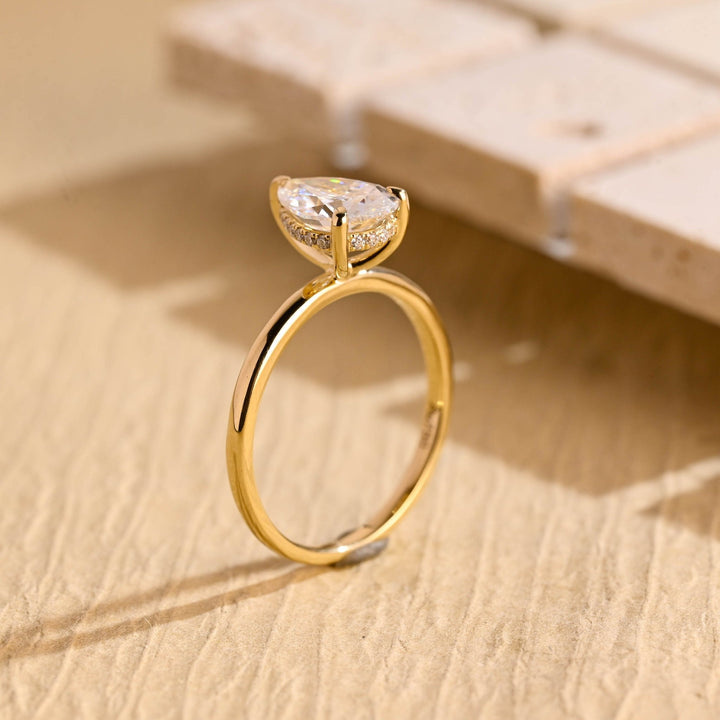 Top-down view of pear cut hidden halo engagement ring