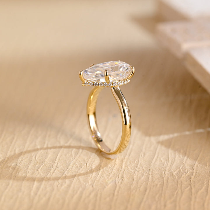 Pear cut engagement ring side view showing band detail