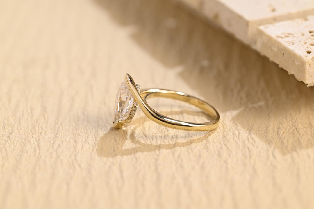 Profile view of pear cut solitaire engagement ring band