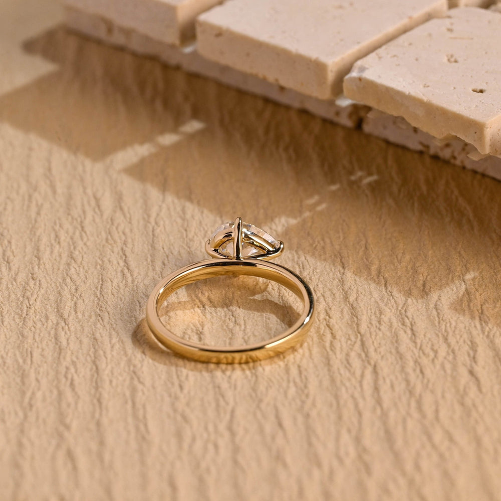 Handcrafted pear cut east west lab grown diamond engagement ring