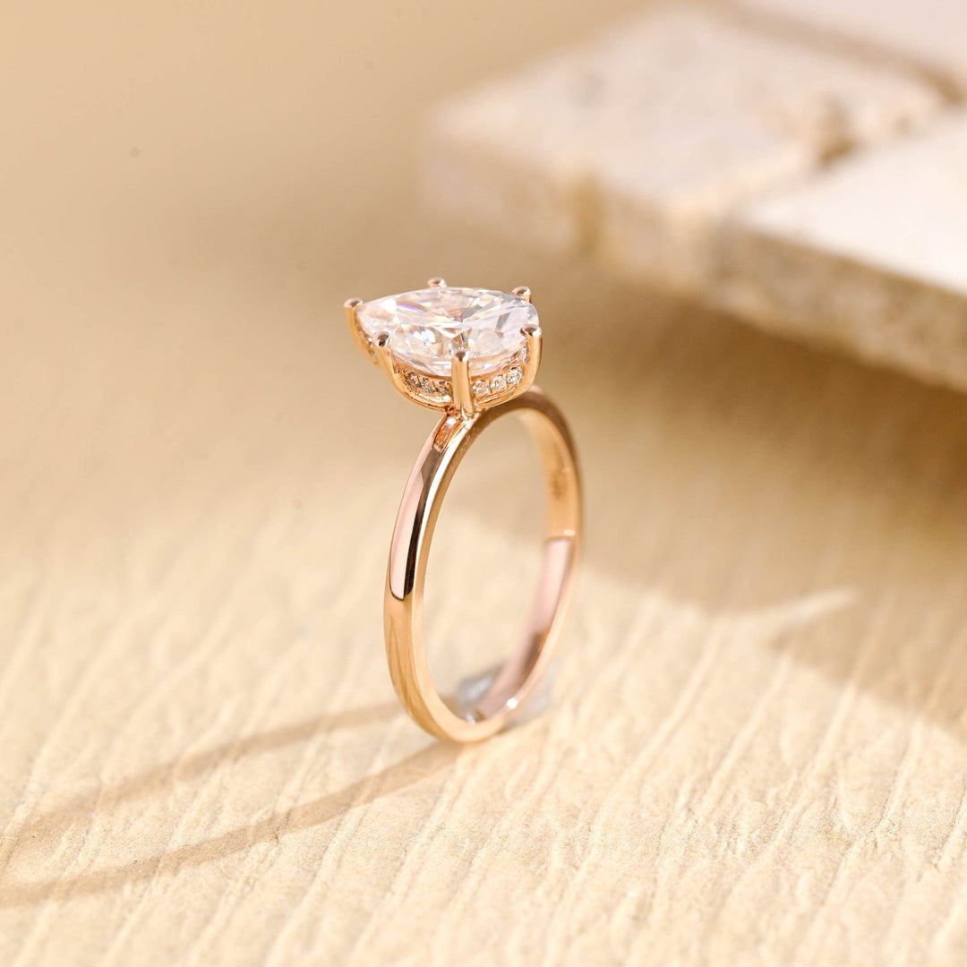 Premium pear cut hidden halo engagement ring crafted in solid gold