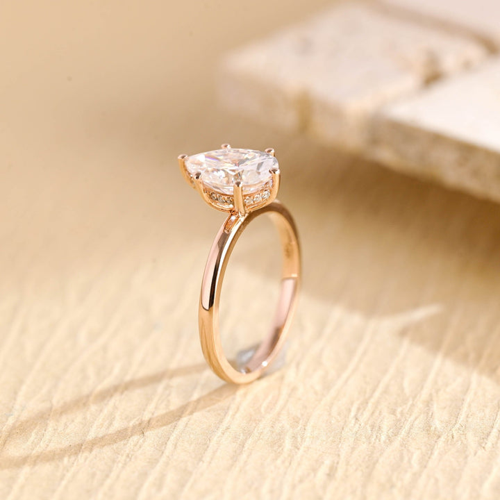 Premium pear cut hidden halo engagement ring crafted in solid gold