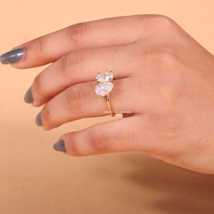 Oval solitaire engagement ring close-up showing E/VS2 diamond clarity