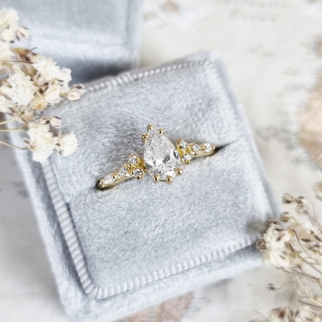 Pear pave engagement ring offered in gold and platinum