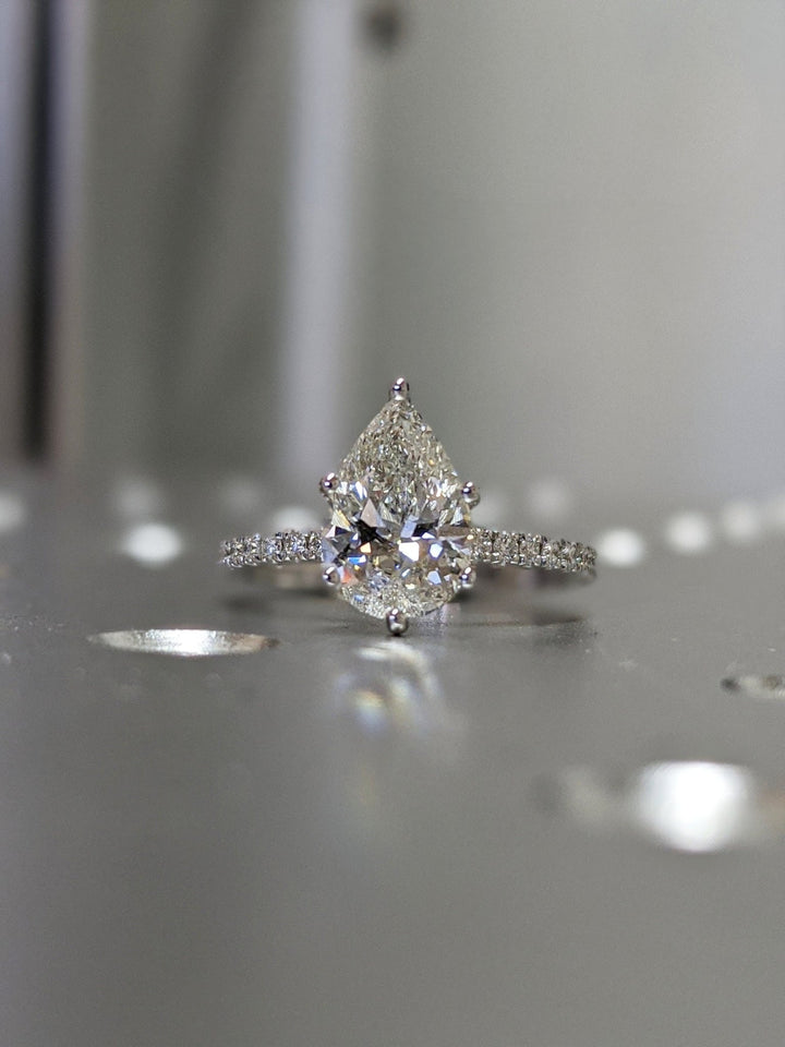 Lifestyle shot of pear pave diamond ring on hand