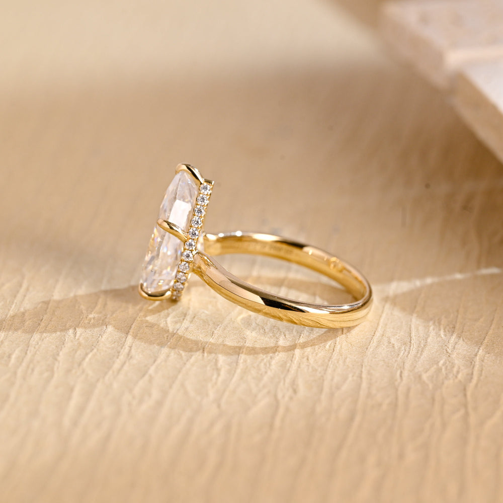 Macro shot of pear cut diamond facets in hidden halo ring setting
