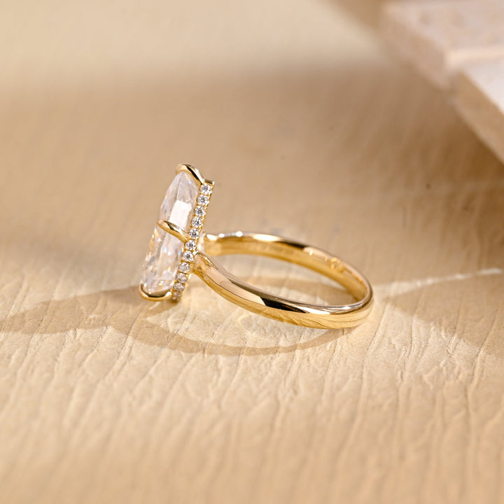 Macro shot of pear cut diamond facets in hidden halo ring setting