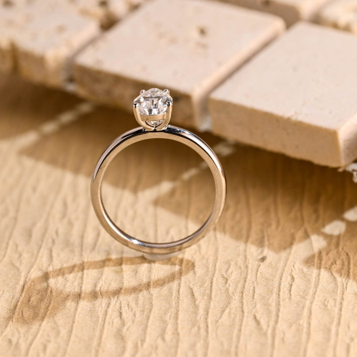 Pear solitaire engagement ring photographed in natural light
