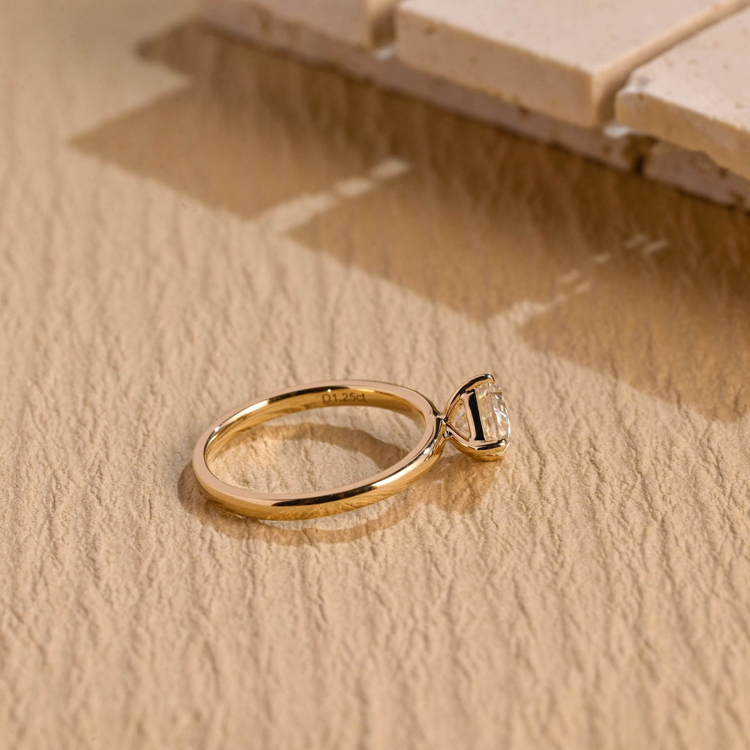 Pear east west engagement ring photographed in natural light