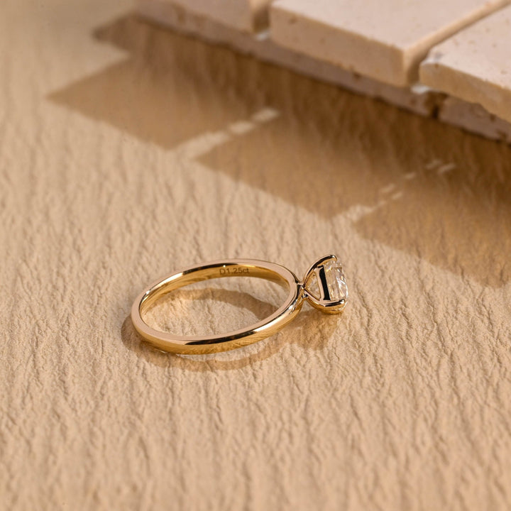 Pear east west engagement ring photographed in natural light