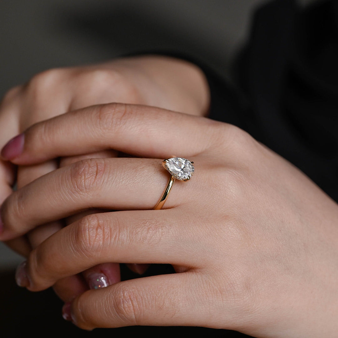 Pear hidden halo engagement ring with brilliant diamond sparkle