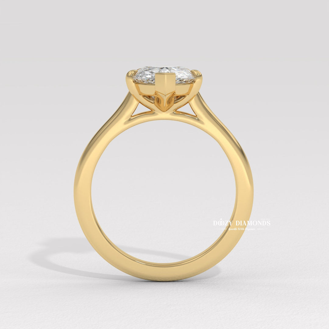Pear solitaire engagement ring photographed in natural light
