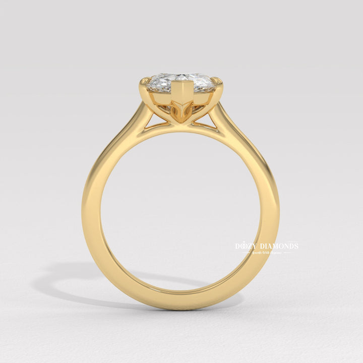 Pear solitaire engagement ring photographed in natural light