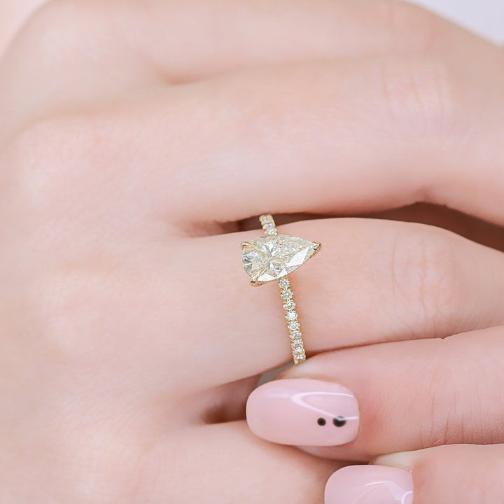 Side angle of pear hidden halo diamond engagement ring