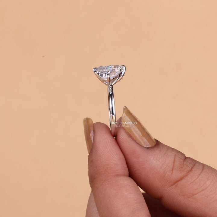 Side angle of pear solitaire diamond engagement ring