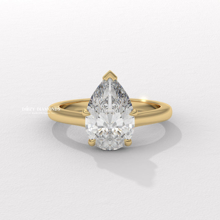 Pear cut solitaire engagement ring available to buy now
