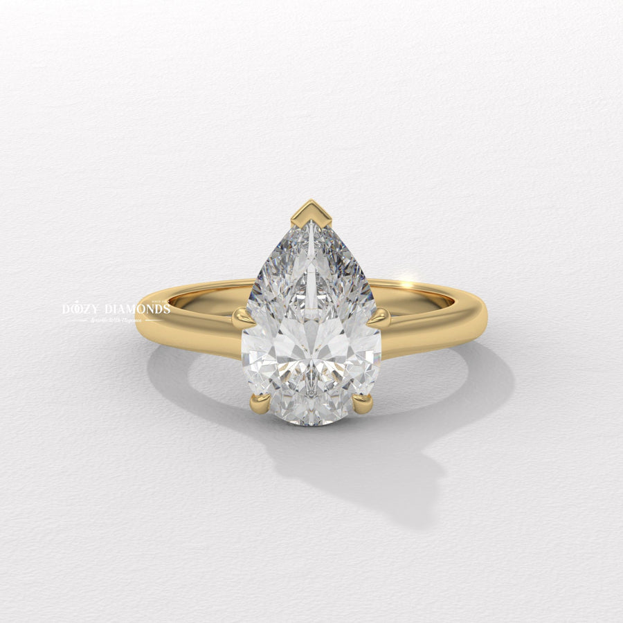 Pear cut solitaire engagement ring available to buy now