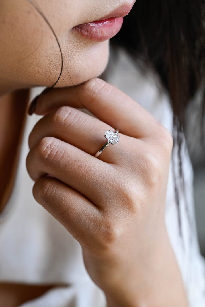 Fine craftsmanship detail on pear solitaire engagement ring
