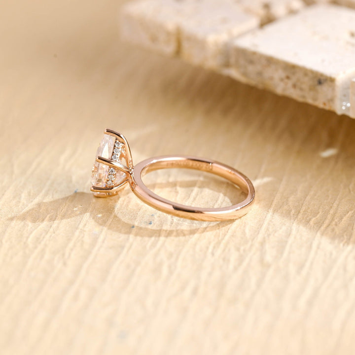 Unboxing view of pear cut hidden halo diamond engagement ring