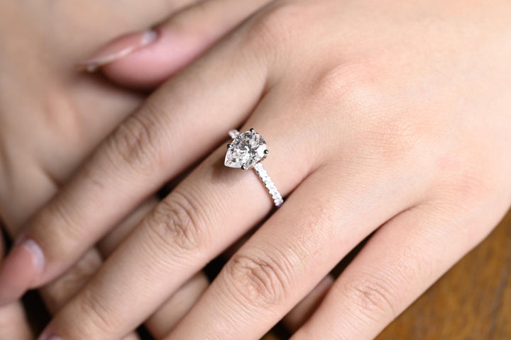 Pear hidden halo lab grown diamond ring side profile in gold setting