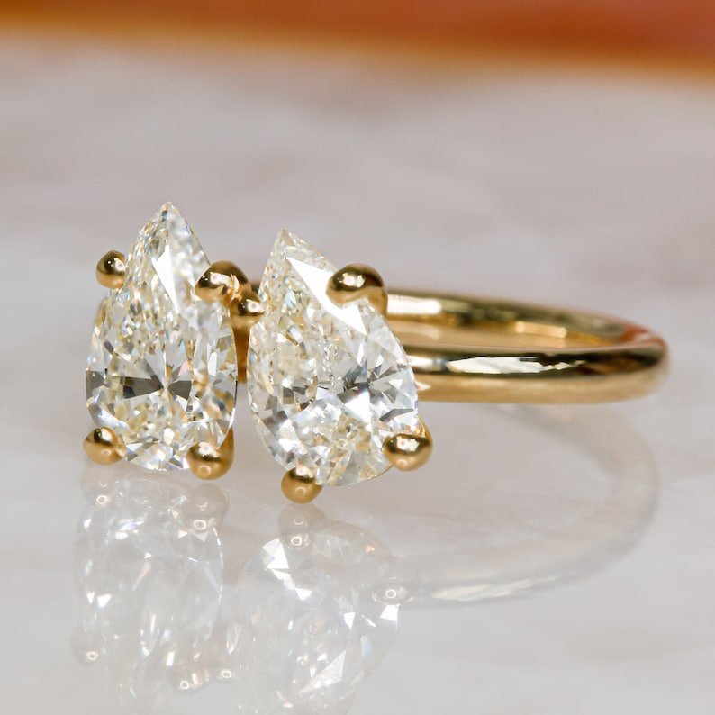 Pear cut engagement ring side view showing band detail