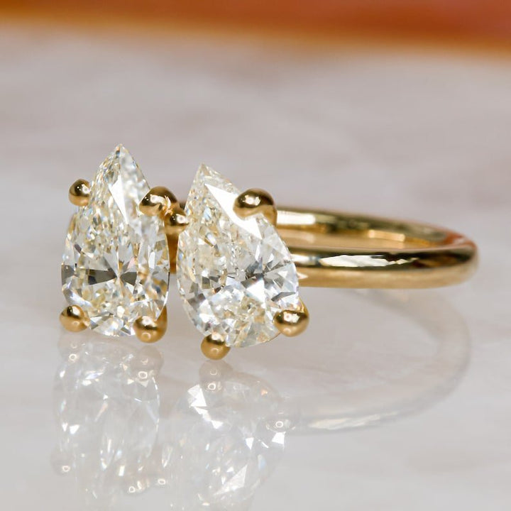Pear cut engagement ring side view showing band detail
