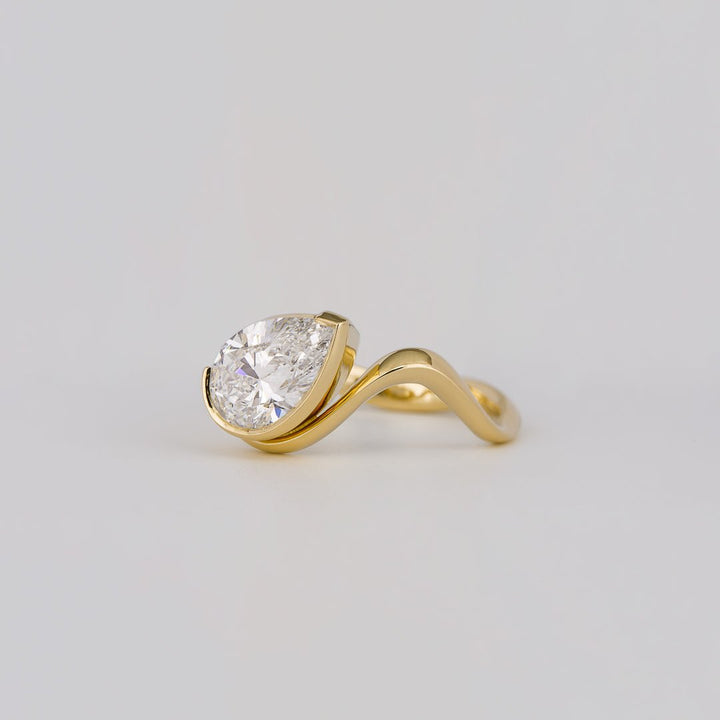 Pear cut solitaire engagement ring with IGI certified center diamond