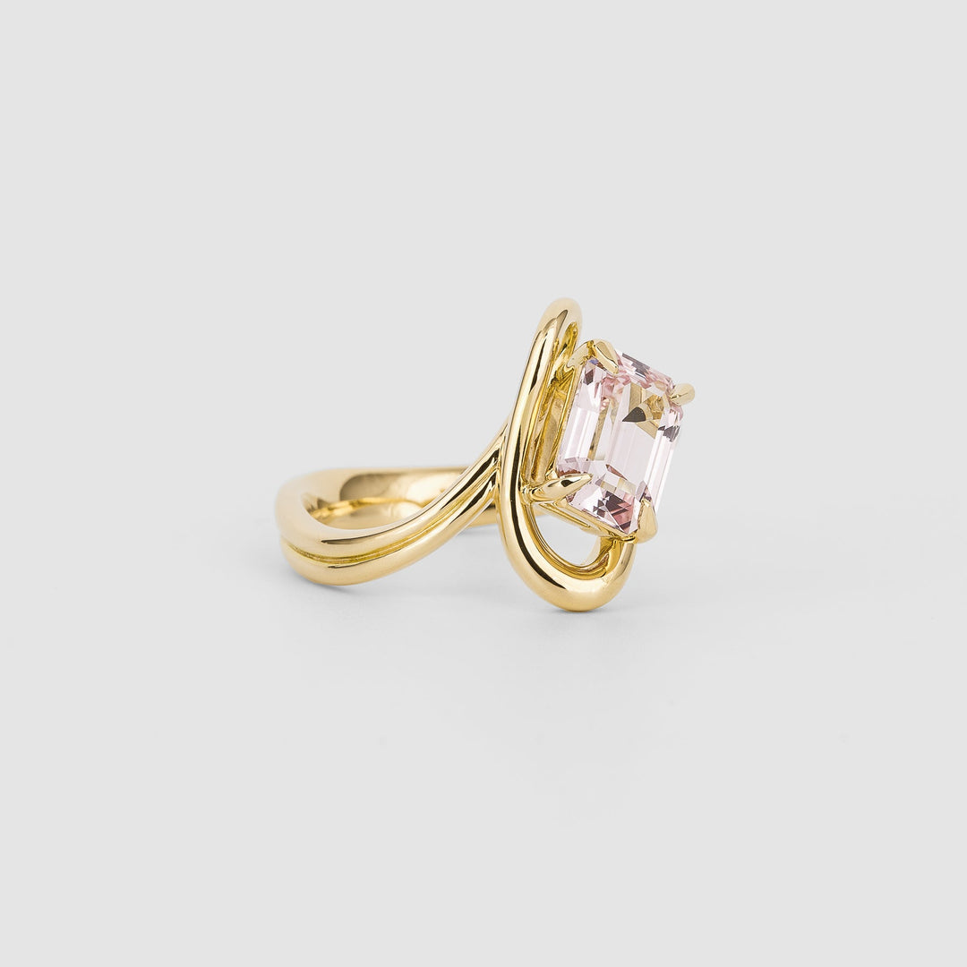 Emerald solitaire engagement ring finished in polished solid gold